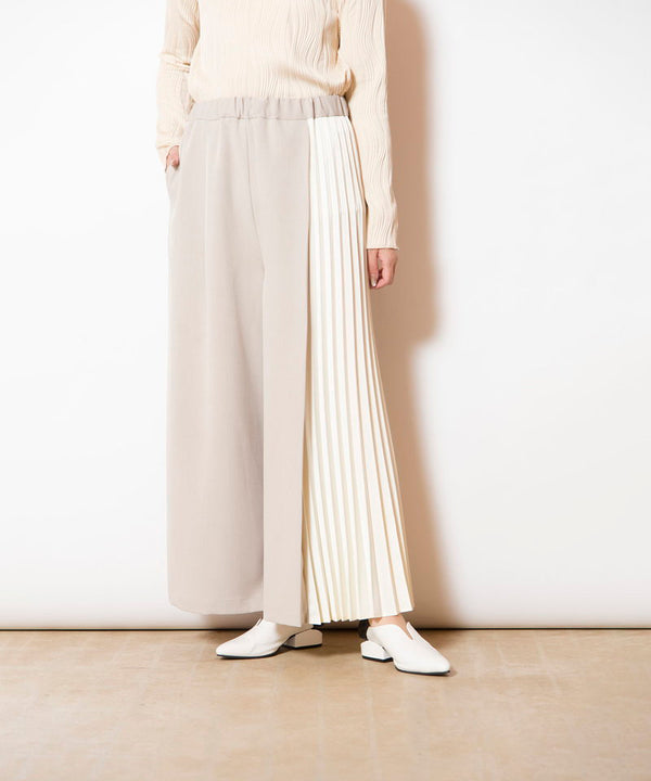 Asymmetrical pleated pants