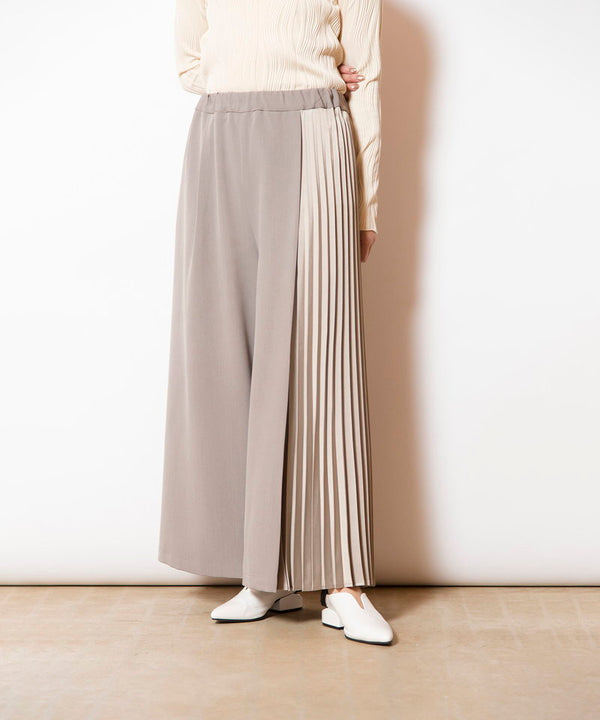 Asymmetrical pleated pants
